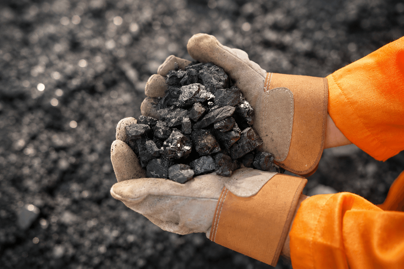 Gloved hands holding an industrial material sample ready for QA and sourcing decisions